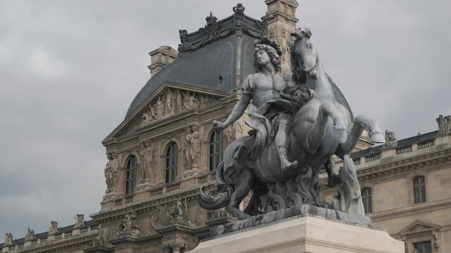 Louis XIV on horse statue near famous Louvre museum closeup