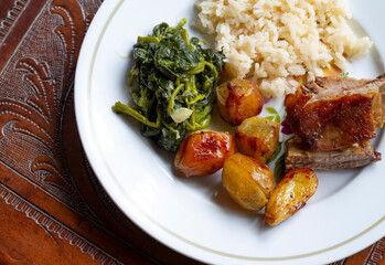 Roasted Veal with Turnip Greens some Rice and Potatoes, Braga, Portugal.