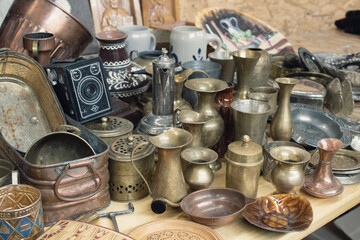 Antiques on flea market or festival - vintage silver cultery - spoons, knifes, forks and other vintage things. Collectibles memorabilia and garage sale concept. Selective focus