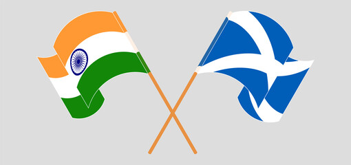 Crossed and waving flags of India and Scotland