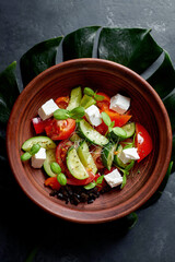 Classic Greek salad with cheese, tomatoes, cucumbers and micro herbs. National Greek cuisine