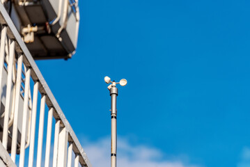 Wind force meter (anemometer) on the roof of a modern building.