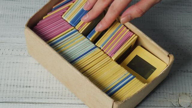 Old Slides and Negatives film 35mm on a wooden table