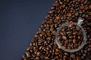 Coffee beans texture or coffee beans background. Brown roasted coffee beans. Closeup shot of coffee beans.