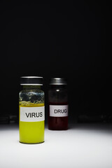 medical ampoules with drugs on a dark background