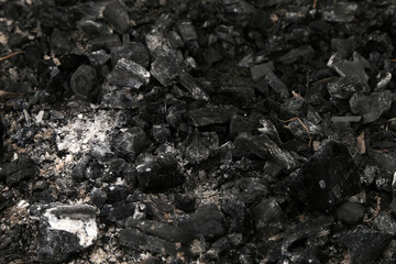 embers from a fire on the ground