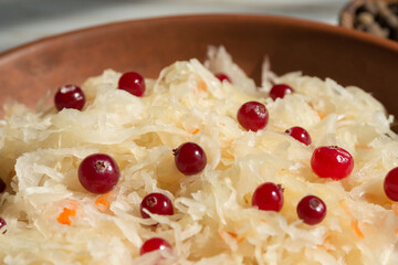 Sauerkraut with cranberries close-up. Fermented vegetables. Super product for proper nutrition. Closeup.