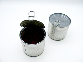 Two tin cans on a white background. One is open and the other is closed.