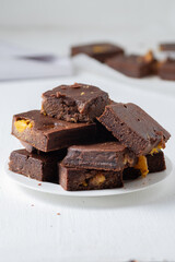 Pieces of chocolate brownie with tangerines