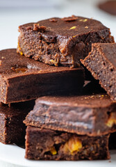 Pieces of chocolate brownie with tangerines