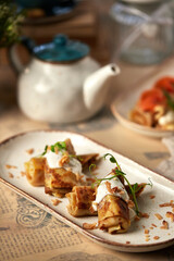 Assorted Russian pancakes with different fillings: red caviar, salmon, meat, chocolate