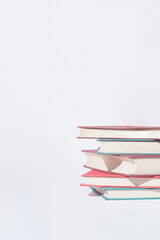 Srack of  old books on white background. Minimal concept. Good copy space.