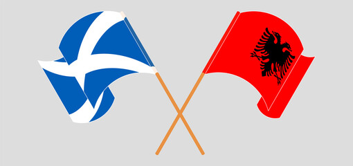 Crossed and waving flags of Scotland and Albania