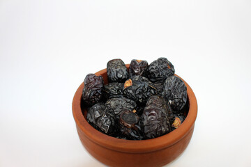 Ajwa dates. Dried dates. Prophet dates on white background. Iftar time