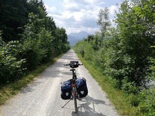 Always straight ahead. A fully packed touring bike on the way to the mountains.