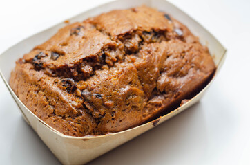Freshly made spiced fruit  loaf cake  on the white  background
