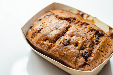 Freshly made spiced fruit  loaf cake  on the white  background