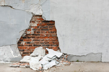 old broken brick wall in cracks