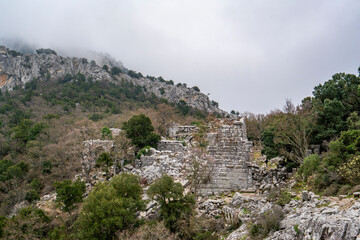 Fototapeta premium Scenic view of Termessos, which was a Pisidian city built at an altitude of more than 1000 metres at the south-west side of the mountain Solymos (Güllük Dağı) in the Taurus Mountains, Antalya Turkey