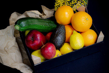 black wooden box with fruits and vegetables