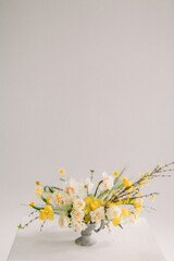 bouquet of yellow flowers in a vase