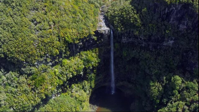 Aerial view of Risco Waterfall, Raba&ccedil;al, Paul da Serra, Central Madeira. The waterfall is inside a subtropical rainforest. These laurisilva forests are designated as a World Heritage Site by UNESCO