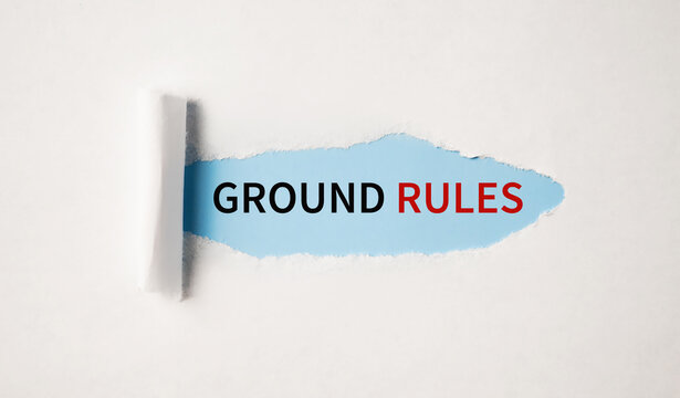 The text GROUND RULEs appearing behind torn white paper