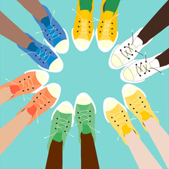 feet in colorful sneakers stand in a circle