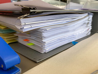 Pile Of Documents On Desk Stack Up High Waiting To Be Managed