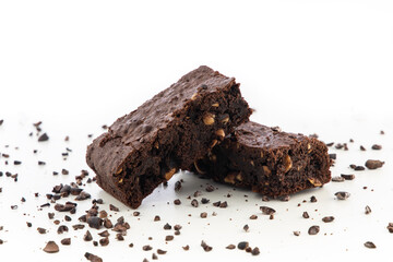 Brownie pieces on white background. Delicious chocolate pie.