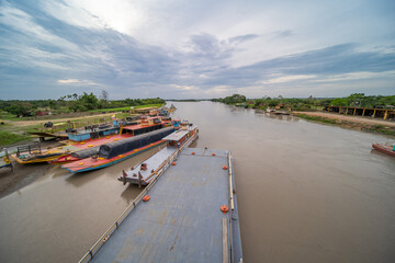 Fototapeta na wymiar View from the Carlos Llenas bridge, on the Metica river, Puerto Lopez, Meta, Colombia