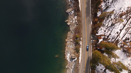 4K Aerial drone video of snowy lake highway