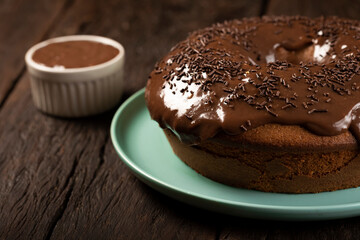 Homemade chocolate cake with chocolate sauce topping.