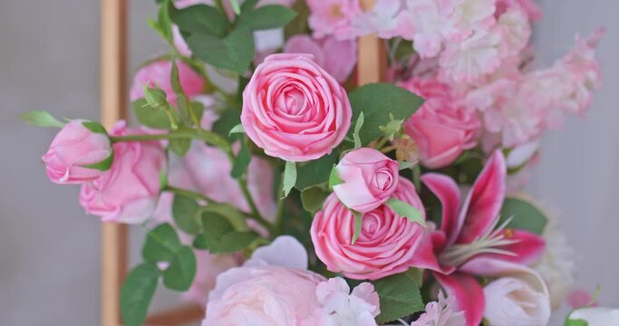 Bouquet of flowers of roses and buds, delicate flowers in the interior. Beautiful bouquet of flowers, wedding room interior decoration. Close-up. 4k, ProRes