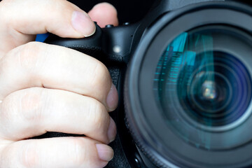 A pressing the shot button of a camera, close up. A take a picture.