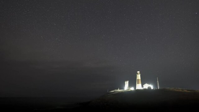 Night to day time lapse at Montauk Point of the Milky Way Galaxy and Falcon 9 SpaceX Launch in New York