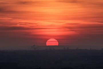 Sunset behind the city.