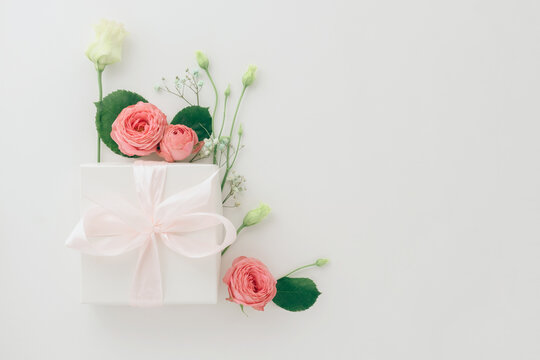 Mother's Day Card, Pink Background With White Flowers And A Present Postcard Gift, Flatlay Copyspace Background