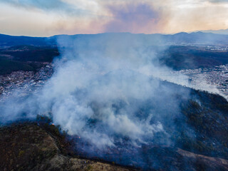 fire on a mountain near a city