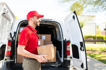 Side view of a courier working and delivering parcels