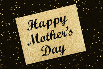 Happy Mothers Day message on gold glitter greeting card
