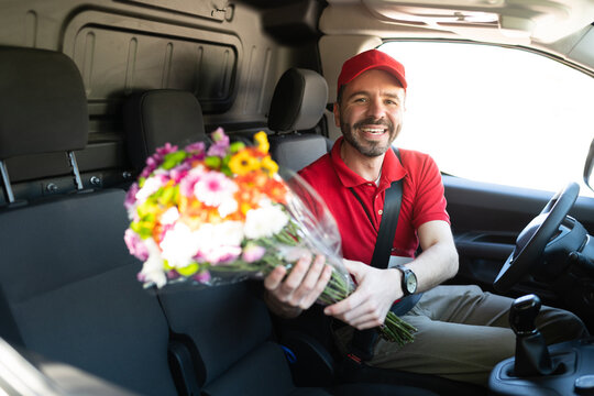 Latin Delivery Driver Giving Flowers To A Customer