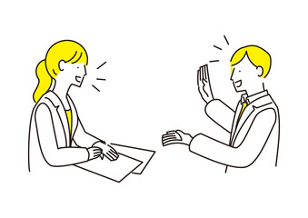 書類をもとに話し合う男女