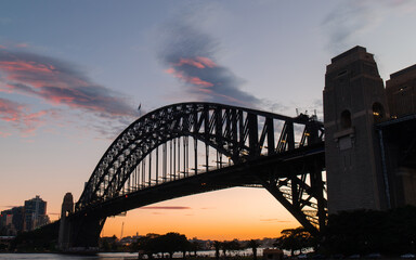 Silhouette of Sydney Harbour Bridge at sunset time.