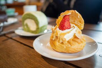 Strawberry cake on a wooden table
