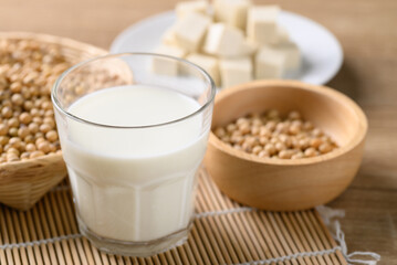 Soy milk in a glass with soybean seed and tofu, Healthy drink