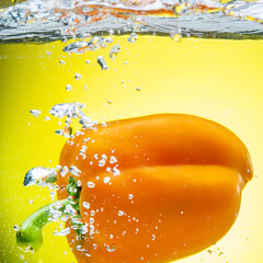 Bulgarian Orange Pepper Splashes Water Yellow Background Fresh Vegetables Healthy Food Concept