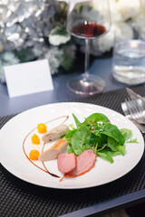 sliced duck on white plate