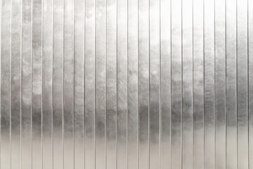 Silver metallic shining wall pattern, vertical lines, architectural design concept, closeup