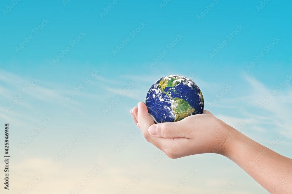 Canvas Prints environment day concept, globe in child hands over blue sky background. save of earth. elements of t